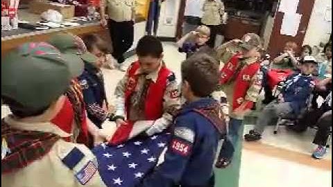 Cub Scouts fold American Flag