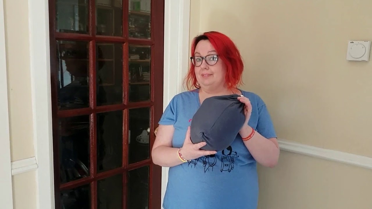 Putting a baby into a Close Caboo sling.