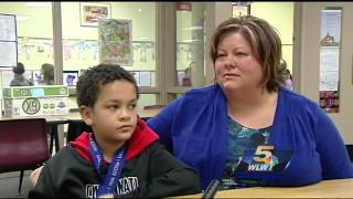 Boy is honored for making call that saved mom's life