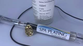 Gold brush plating silver clay.