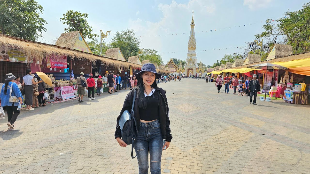 สาวลาวข้ามโขงเที่ยวงานบุญนมัสการพระธาตุพนมครั้งแรก คนลาวมาหลายคัก