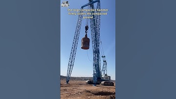 The large compaction hammer firmly strikes the compacted ground
