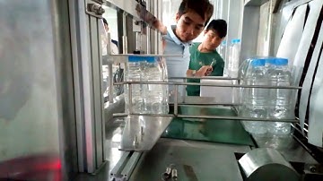 Máy đóng lốc chai nước suối, nước ngọt lốc 12chai, 24 chai tự động