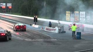 08 Charger SRT8 vs Camaro Drag Race