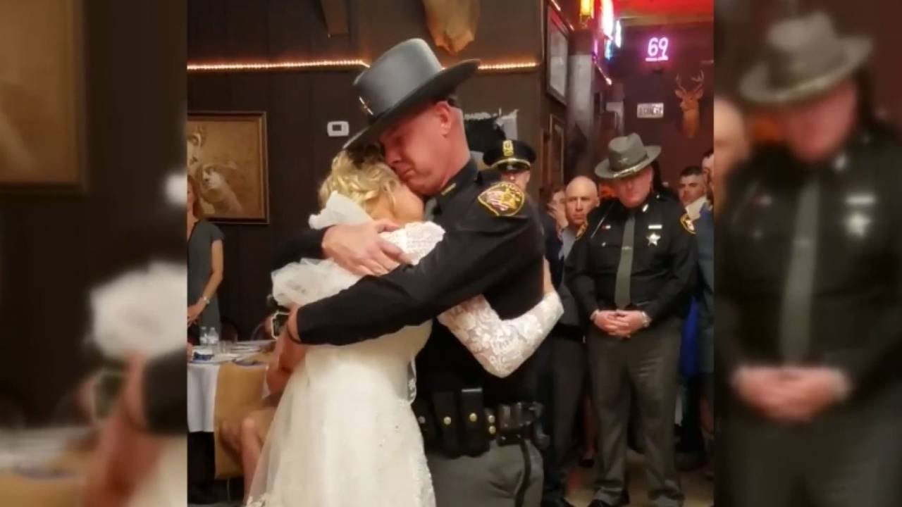 Fathers in blue surprise bride for father daughter wedding dance