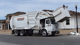 Wittke Starlight Front Loader Collecting Construction Debris