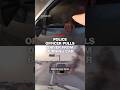 Police officer pulls driver from burning car