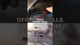Police officer pulls driver from burning car