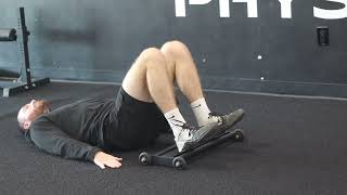 Eccentric only hamstring bridge with glider