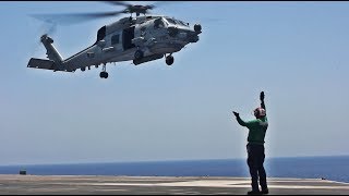 JTsuits Launching and Recovering Navy Helicopters