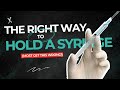 Holding the Syringe for Steady Needle Entry and Product Control