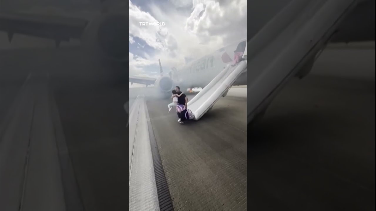 Passengers Evacuate On Tarmac After American Airlines Plane Catches Fire In Denver