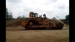 Cat D9N Pushing Big Rock