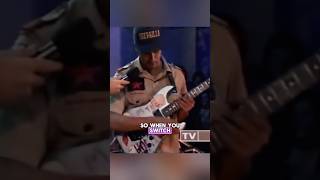 Tom Morello shows how he does his DJ sound guitar trick to Carson Daly