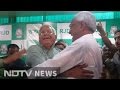 Nitish, Lalu hug each other