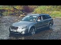 Subaru Outback fords in the mountains