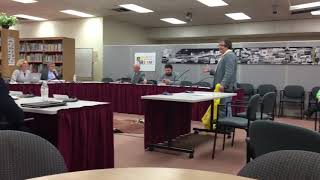 Fitchburg City Councilor Paul Beauchemin poured out a trash bag of nips