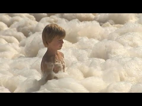 Sea foam swamps Australian beaches amid spell of extreme weather