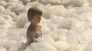 Australia's Gold Coast beaches swamped by foam caused by rough seas - YouTube