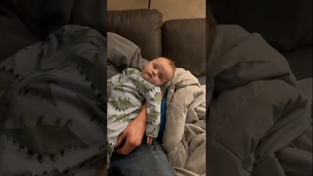 Dads fell asleep while feeding baby.