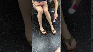 Subway creatures  woman shaves legs with pink razor on subway
