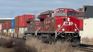 CP stack train with shiny cp AC4400CWM leading at Calgary downtown.