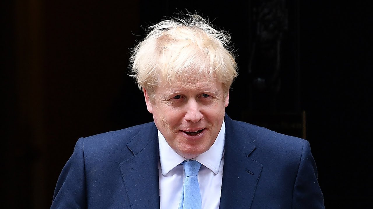 Watch again: Prime Minister Boris Johnson greeted by Angela Merkel and military parade