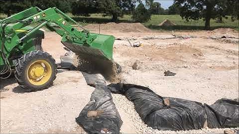 Building a rubble trench foundation and laying the first seven courses of CEBs on a home build
