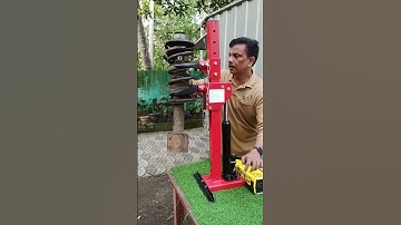 Hydraulic coil spring compressor