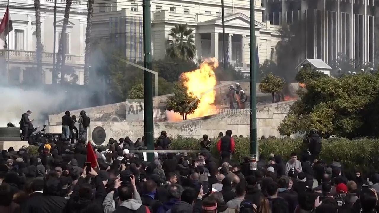 Protesters and police clash in Athens on deadly train crash anniversary