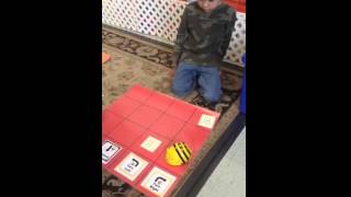 First Graders Coding using Beebots for Math Facts