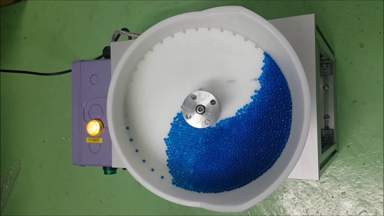 Rotary pocket feeder - YouTube