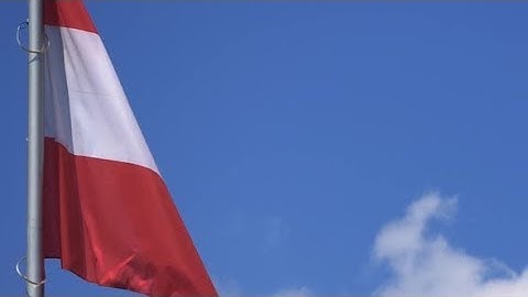 Austria Flag Fluttering Against A Blue Sky, Close-up | Stock Footage - Videohive
