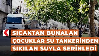Şanlıurfa’da hava sıcaklığından bunalan çocuklar su tankerinden sıkılan suyla serinledi