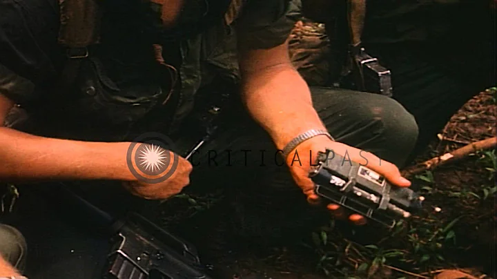 US Army 1st Infantry soldiers work on wireless communication devices while patrol...HD Stock Footage