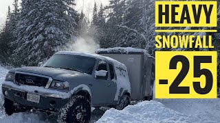 Cargo trailer camping in heavy snowfall and 25 degree weather.