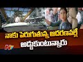 YS Sharmila protests in the middle of the road while seated in a car; tension at Somajiguda