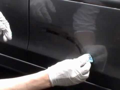 Repair scratched car door.