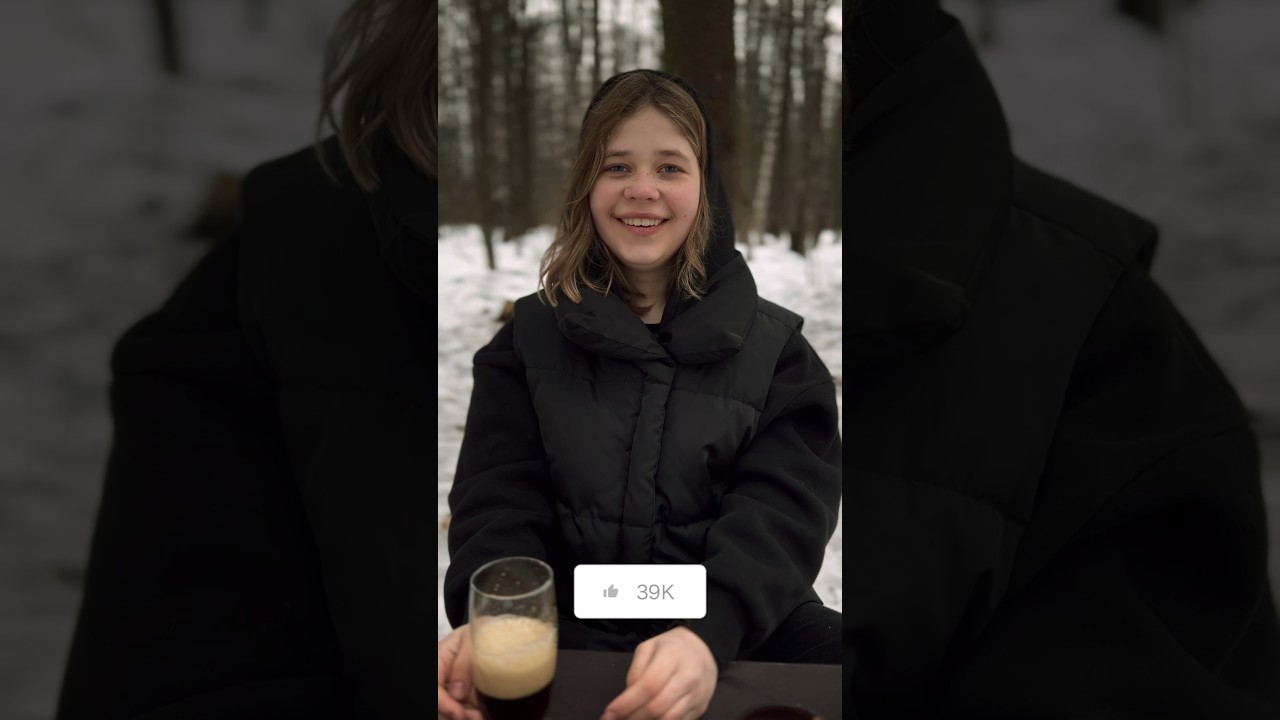 A girl cooks shrimps alone in the winter forest. 