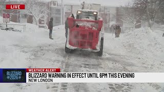 Crews work to clean lot in New London amid storm