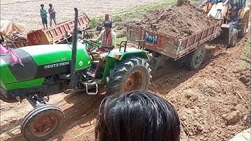 #tractorstauckvideo  Deutz Fahr 50 fully loaded trolley tractor stuck in Mud. help jcb machine.