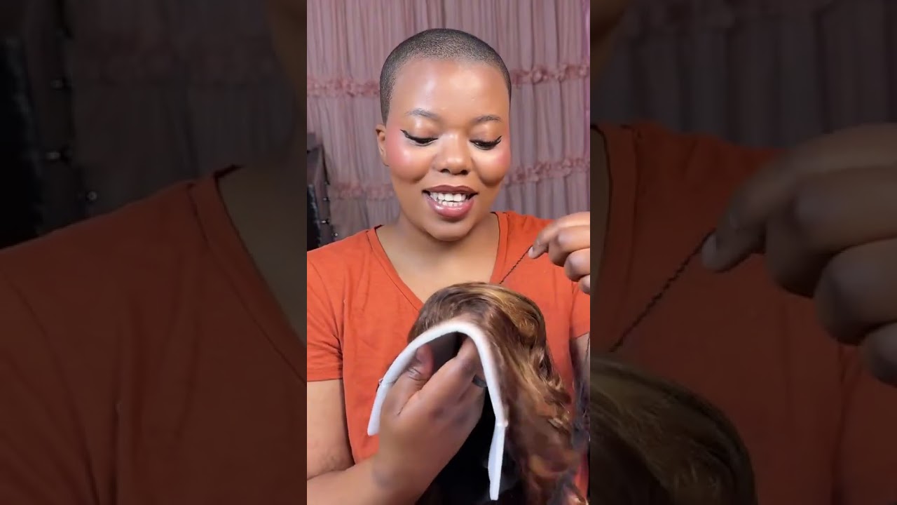 Sculpted curls, side-parted elegance.  