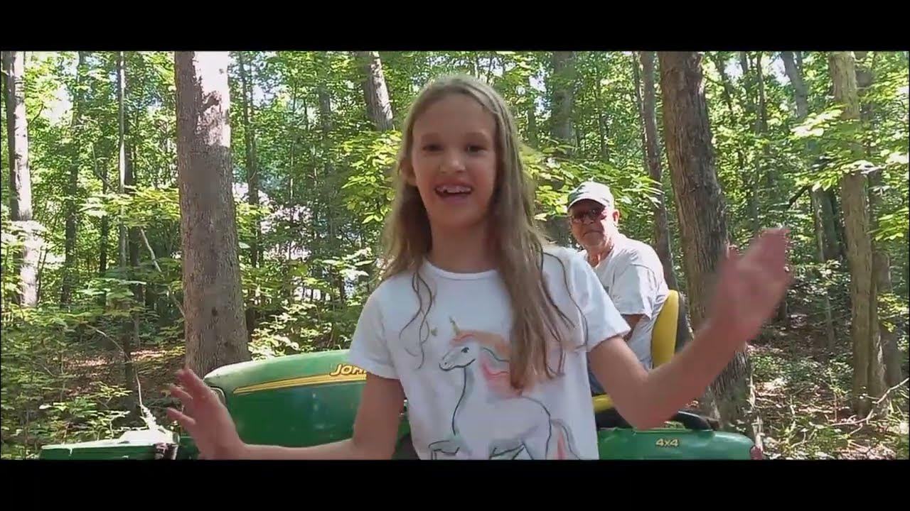 Buford Bucket Loader on JD X Series Tractor In Action Clearing Woods