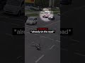 Biker Falls Infront Of Ambulance