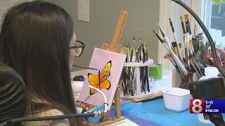 West Haven woman forges new path from tragedy, using her mouth to paint