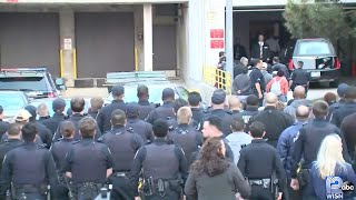 Officer Kou Her's body arrives at Medical Examiner's Office