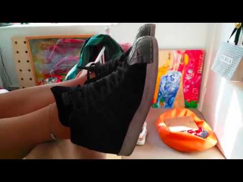 Removing her Adidas Superstars UP