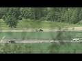 Zurich Winkel tractor turning cut grass on a sunny spring day.