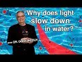 Why does light slow down in water?