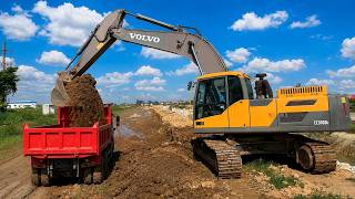 Volvo EC300DL Excavator Loading Dirt into Dump Truck Heavy Equipment in Action